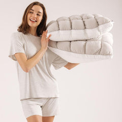 Two puff pillows with quilted puff-grid design